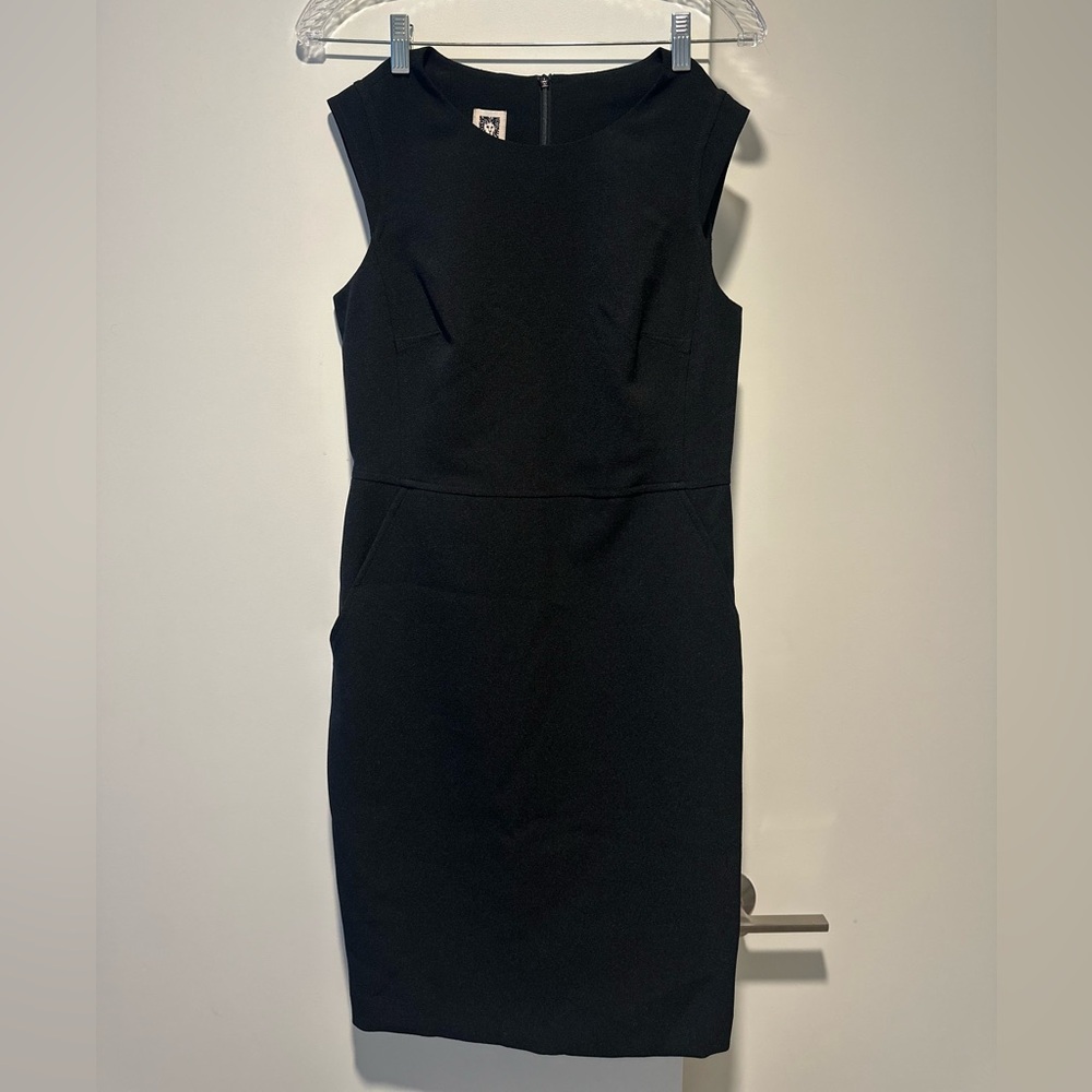 Mid length, formal black dress. The brand is Anne Klein.